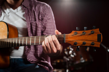 Obraz premium Close-up acoustic guitar grif with strings