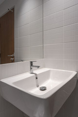 Modern faucet and white ceramic washbasin sink bathroom interior building decoration