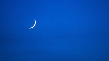 Obraz na płótnie Canvas waxing crescent moon on the sky timelapse