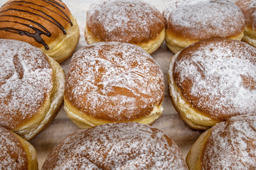 sweet fresh donuts on counter in a bakery