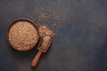 Buckwheat groats on a concrete background. Top view with copy space.