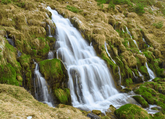 Fototapeta na wymiar Waterfall in Puerto de Aisa, birth of the Estarrun river, Huesca, Spain