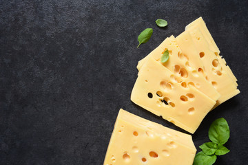 Radamer cheese on a black concrete background. View from above.