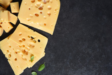 Radamer cheese on a black concrete background. View from above.