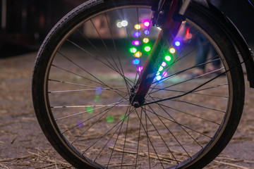 Bike wheels close up look on road at night