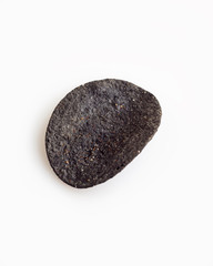 One natural black crispy potato chip