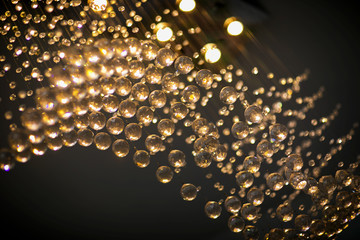 lighting balls on the chandelier in the lamplight, light bulbs hanging from the ceiling, lamps on...