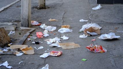  Garbage on a city street. Environmental pollution