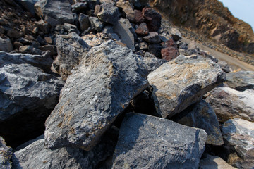 Industrial photography. Volcanic rock at the quarry. Natural stone for the manufacture of blocks and bricks