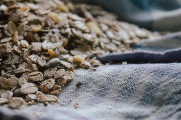 Muesli with nuts for bulk breakfast. Sustainable product in bulk on local typical recycled fabric.