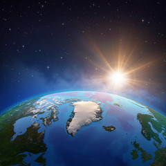 Sun shining over Artic and Greenland from space © mozZz