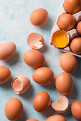Raw eggs on a blue background
