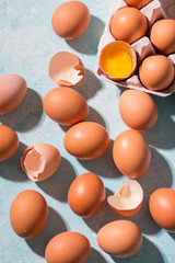Raw eggs on a blue background