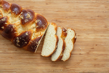 Easter greek tsoureki braid, sweet bread brioche on wood
