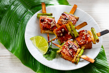 Salmon and spring onion skewers with soy and wasabi glaze