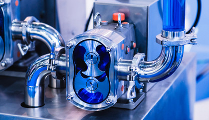 Operator machining automotive part by turning machine, Industry machine background