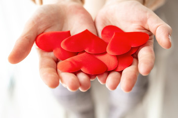 adult hands holding red heart, health care, donate and family insurance concept,world heart day, world health day, CSR concept, adoption foster family