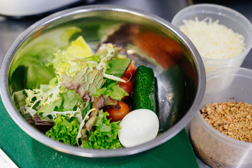 Ingredients for vegetable salad in a metal pan