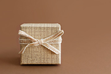 Cream gift box on a brown background