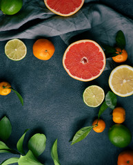 Fototapeta na wymiar Fruit on a dark background. Citrus fruits, healthy food concept. Fresh fruit.