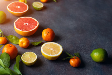 Fruit on a dark background. Citrus fruits, healthy food concept. Fresh fruit.