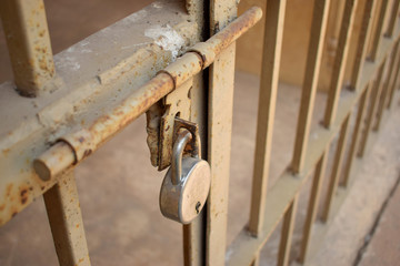 Lock on Old Vintage Iron Gate With Steel Lock stock photo