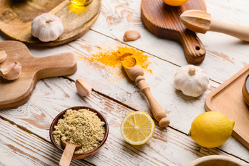 Ingredients for honey mustard sauce on white wooden background
