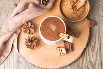Cup of hot chocolate on wooden table