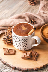 Cup of hot chocolate on wooden table
