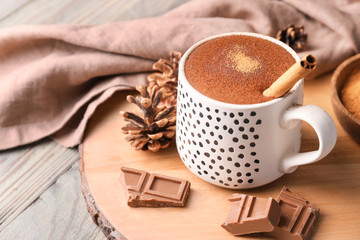 Cup of hot chocolate on wooden table