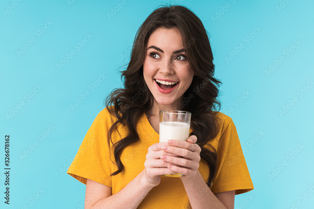 Sticker positive optimistic young beautiful woman holding milk.