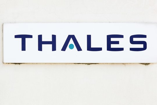 Valence, France - July 1, 2018: Thales logo on a wall. Thales is a French multinational company and an electronics group specializing in aerospace, defense, security and transportation