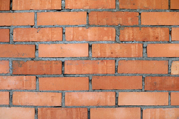 Wall made of red old fashioned bricks as background