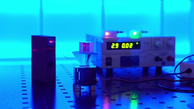  laser in a quantum optics lab. Semiconductor laser on optical table in a quantum physics optics lab.