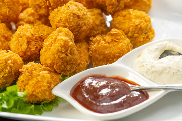 Closeup on chicken nuggets on a plate