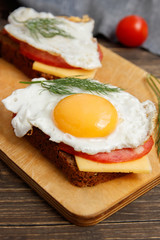 sandwich with fried egg and sausage
