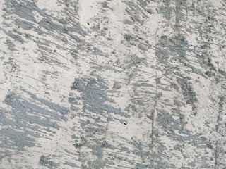 Abstract and texture of embossing on the cement surface caused by flicking the plastering trowel.