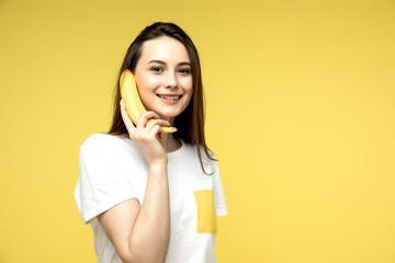 a woman making fun with a banana