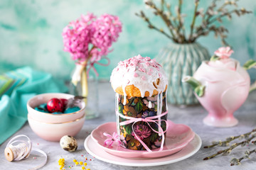 Traditional cupcake Easter cake. Easter cake, colored eggs and spring flowers.