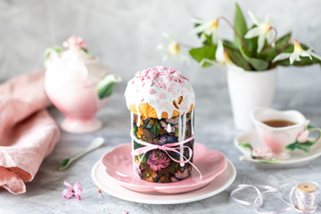 Traditional cupcake Easter cake. Easter cake, colored eggs and spring flowers.