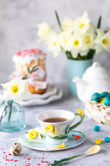 Traditional cupcake Easter cake. Easter cake, colored eggs and spring flowers. vertical