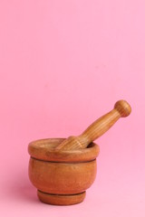 cooking wooden mortar in color background
