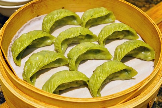 Dim Sum Dumplings In A Steamer Bamboo Basket