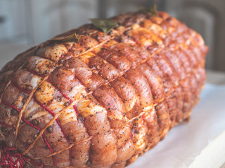 Raw meatloaf. Uncooked spicy meat roulade prepared to roast, marinated with spices and herbs.