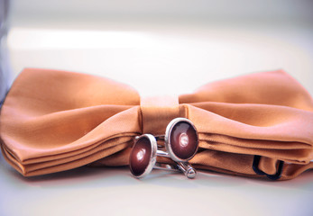 yellow groom's butterfly and cufflinks