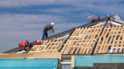 Builders and carpenters working on the roof timelapse