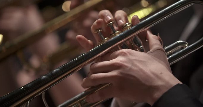 musician playing trumpet at concert