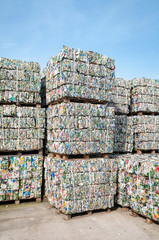 Bundles of consumer waste metal stacked for shipping to recycling facilities