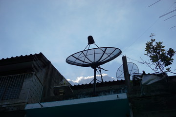 Old satellite dishes on the old roof building