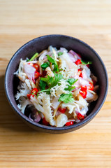 Jelly fish hot spicy and sour salad on wooden table, Thai food thai style.